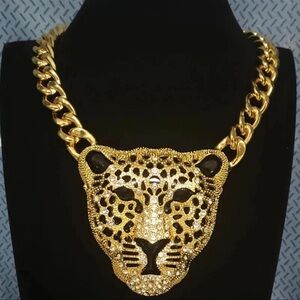 A gorgeous panther head necklace , gold tone with rhinestone and cuban chain